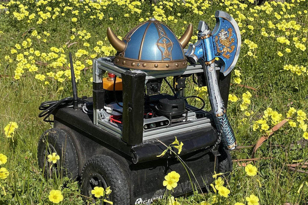 Geographic Hints Help a Simple Robot Navigate for Kilometers
