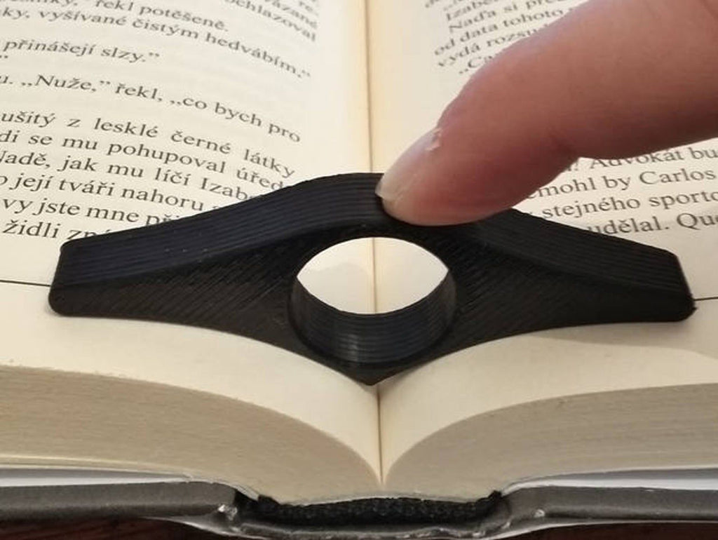 Up Your Reading Game With The Thumb Book Holder